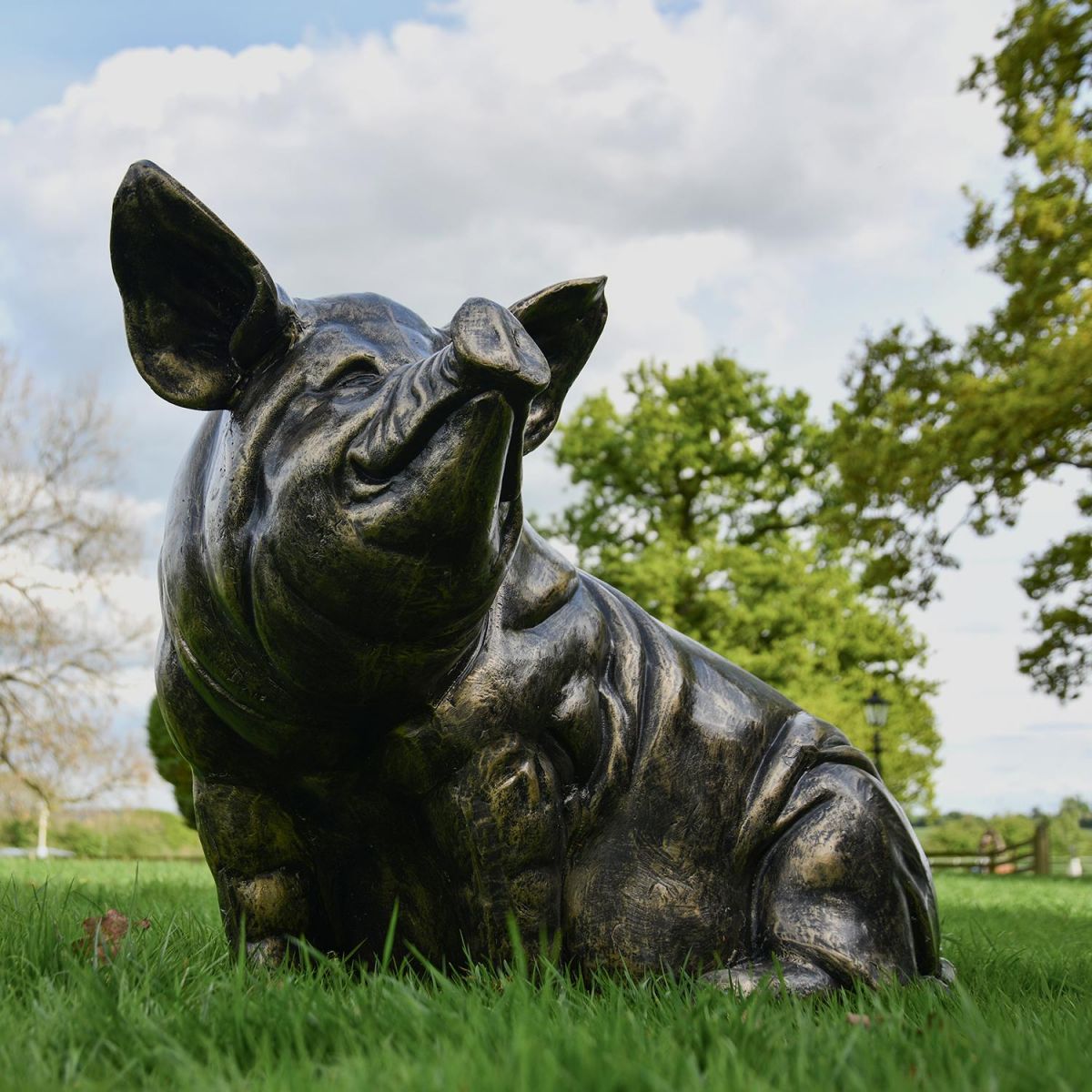 Antique Bronze Sitting Pig Sculpture in the Garden Antique Bronze Sitting Pig Sculpture in the Garden
