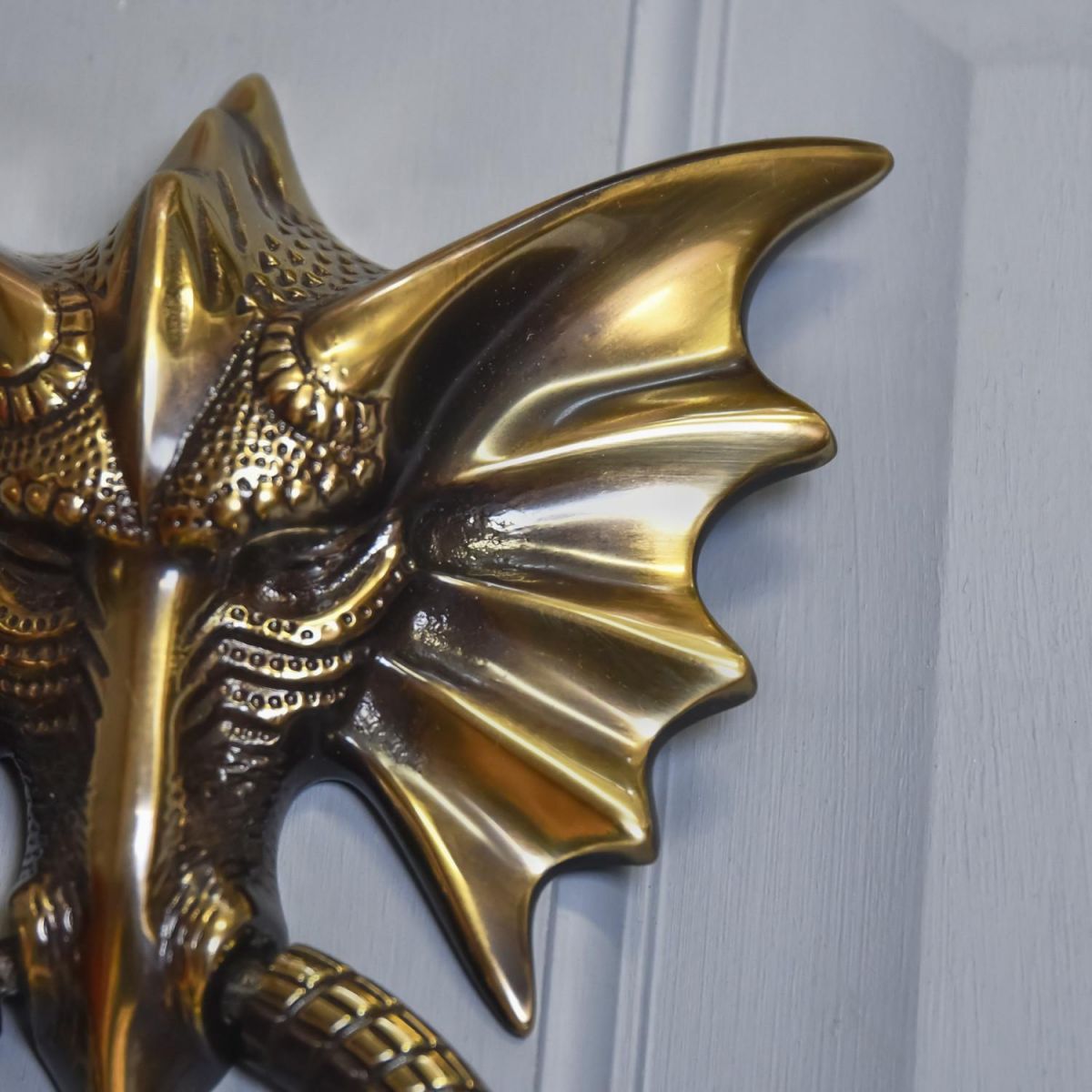 Close-Up of Antique Copper Dragon Head Door Knocker 