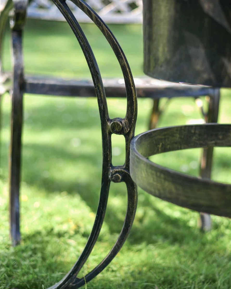 Close-Up of Leg Supports for Antique Gold "Frosted" Four Seater Table & Chair Set with Grill Close-Up of Leg Supports for Antique Gold "Frosted" Four Seater Table & Chair Set with Grill
