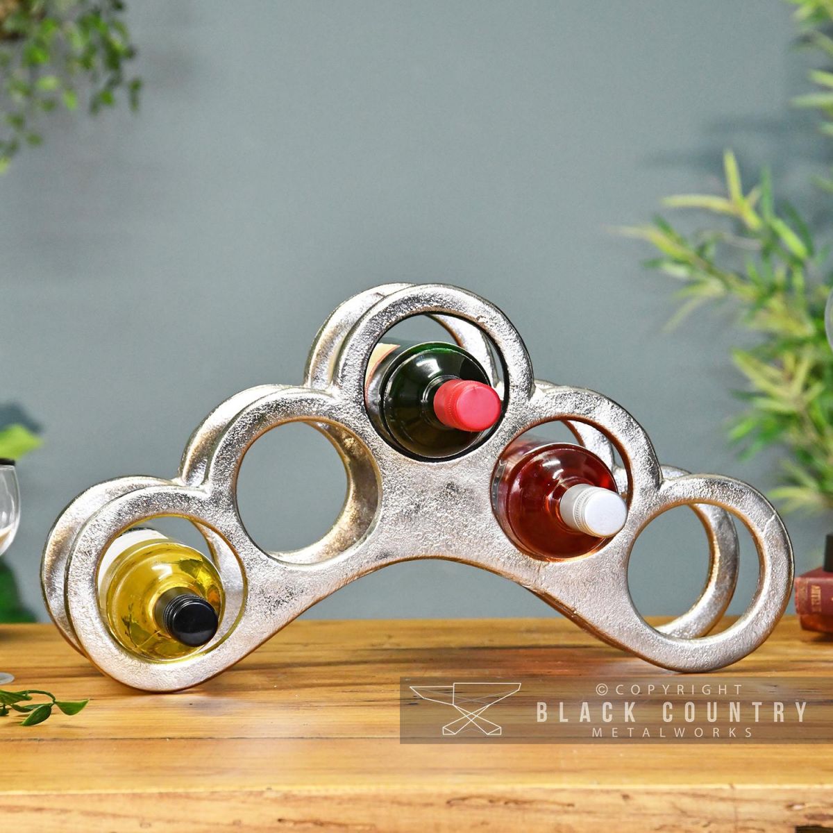 Antique Nickel Arched Wine Rack Holding Wine Bottles