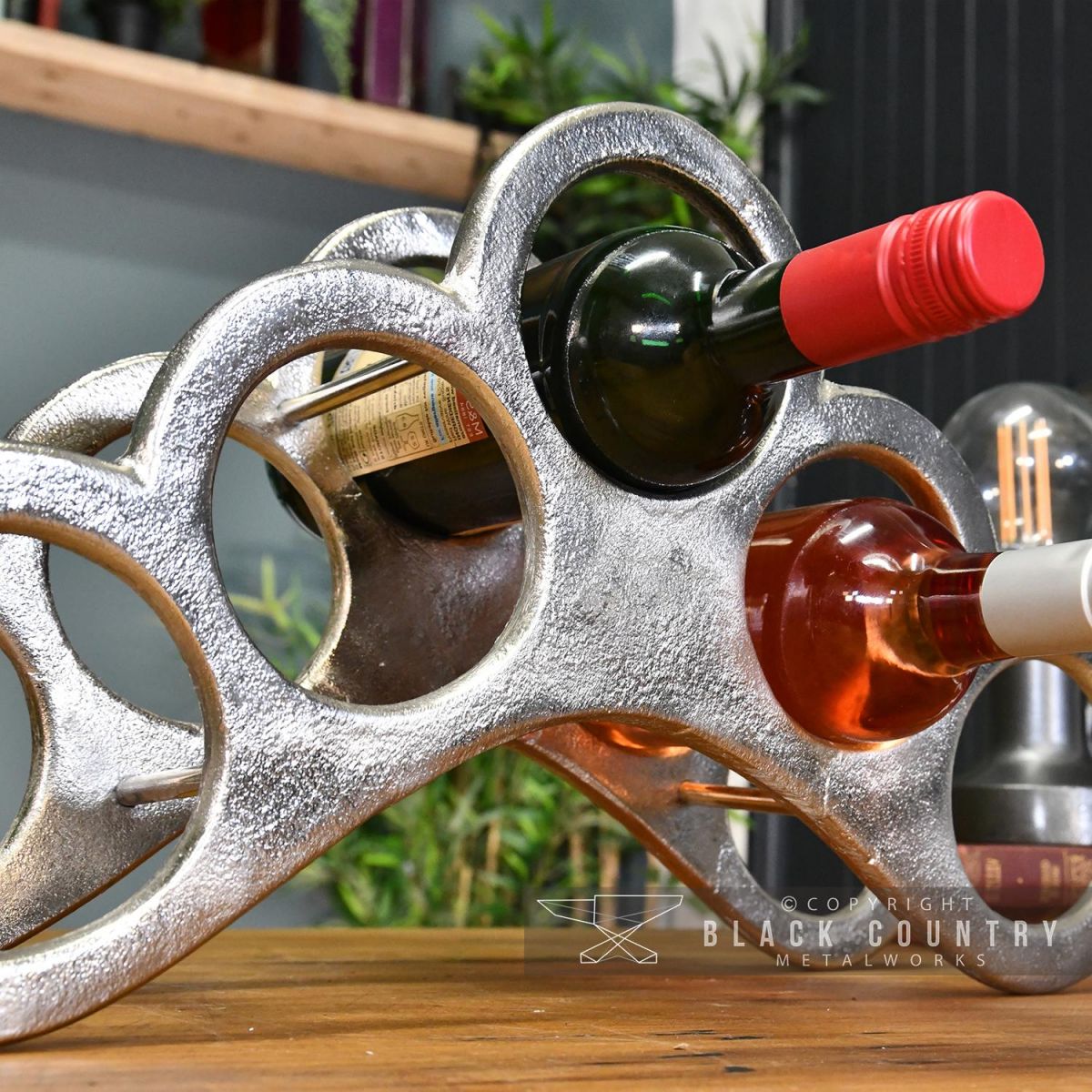 Close-up of the Antique Nickel Wine Rack Holding Wine Bottles