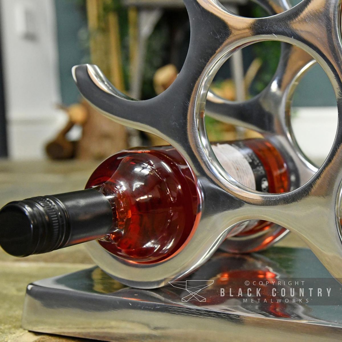 Wine Bottle Being Held in the Wine Rack