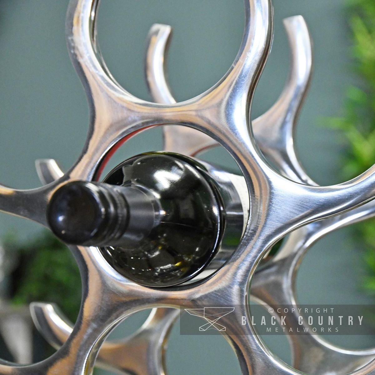 Wine Bottle Being Held in the Wine Rack