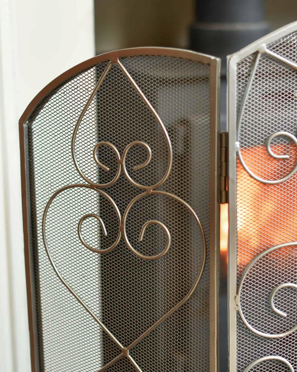 Close-Up of Side Panel of Antique Pewter Heart Design Three Fold Fireguard