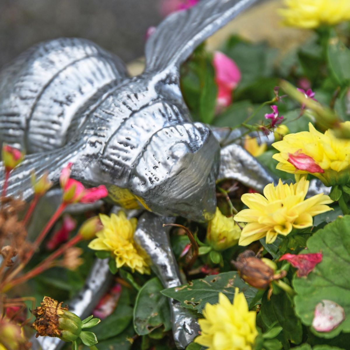 Close-Up of Bumble Bee Sculpture with Flowers