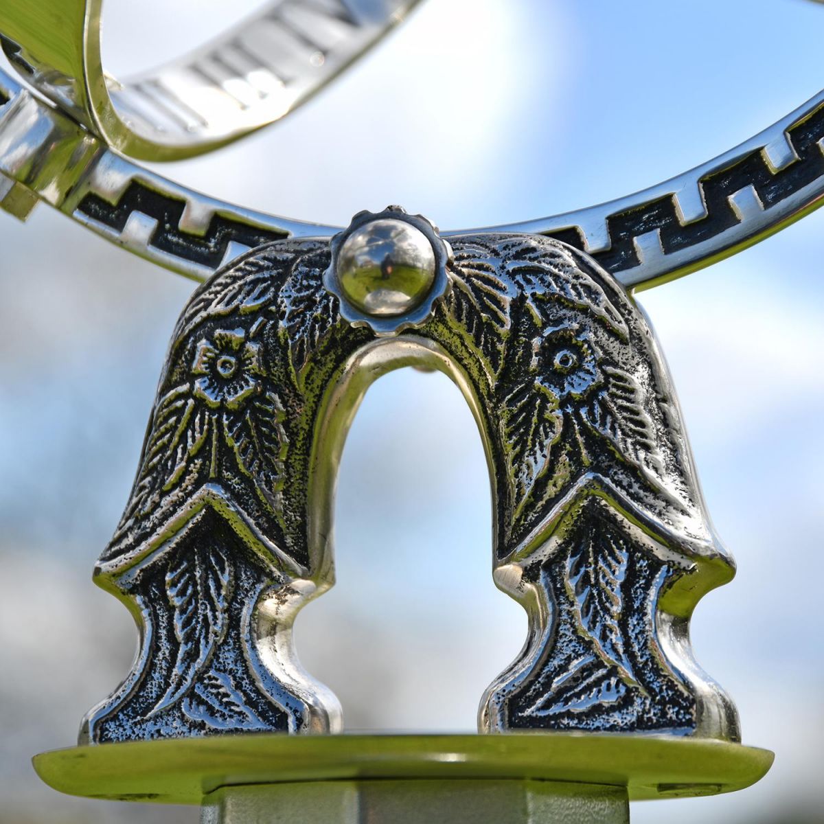 Close-up of the Detail on the Antique Silver Armillary with Column