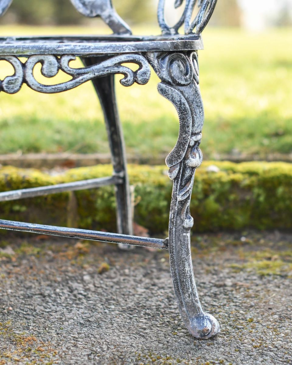 Close Up Of Antique Silver Butterfly Design Two Seater Bench Leg Close Up Of Antique Silver Butterfly Design Two Seater Bench Leg