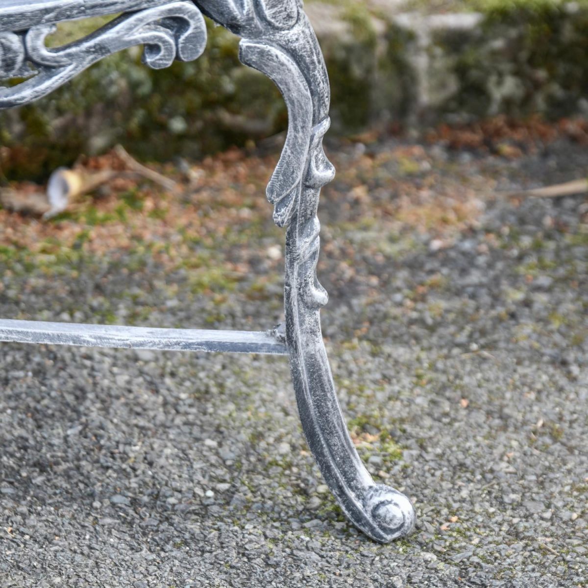 Close-Up of Integral Legs on Antique Silver Outdoor Bench