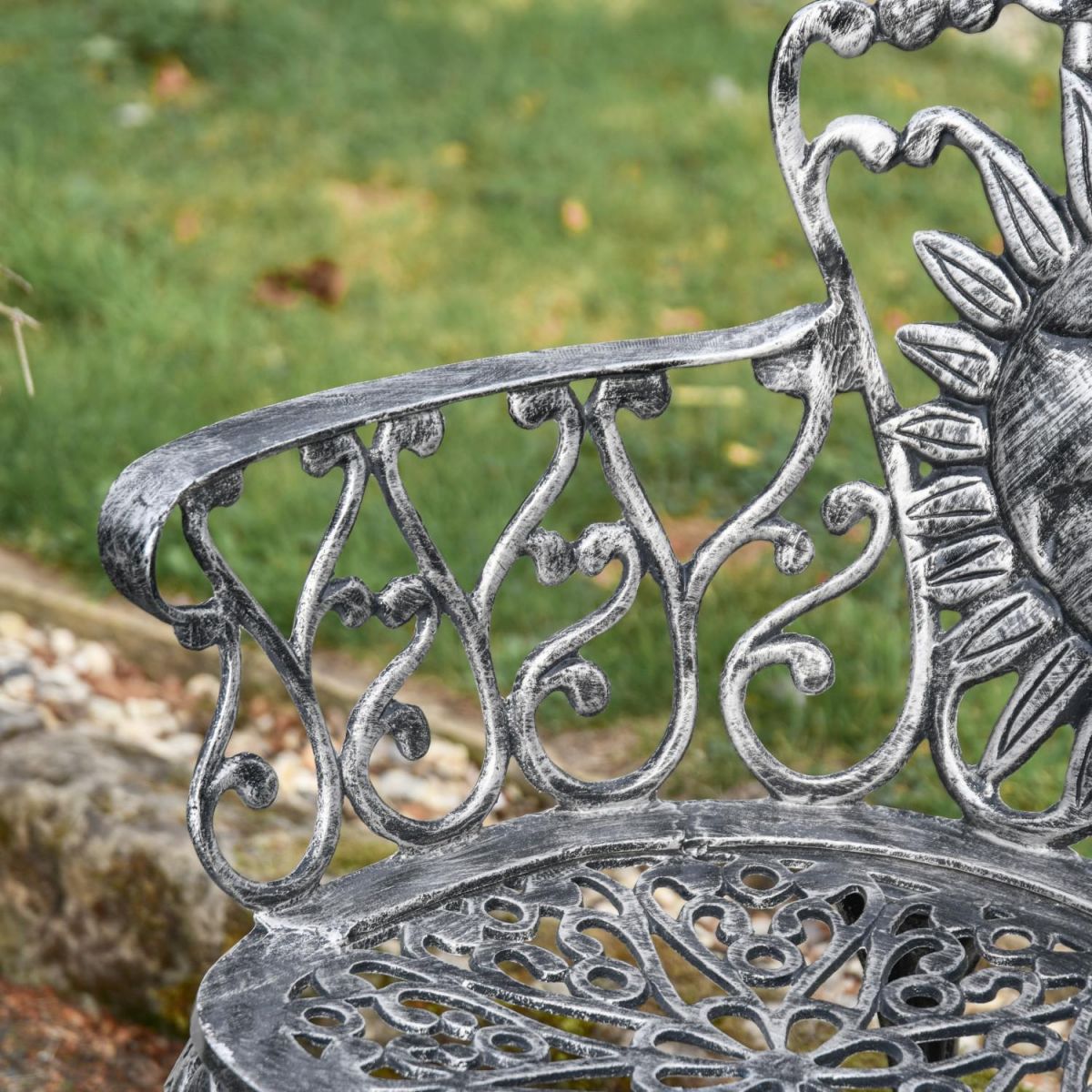 Close-Up of Armrest on Antique Silver "Sunrise-to-Sunset" Two Seater Garden Bench