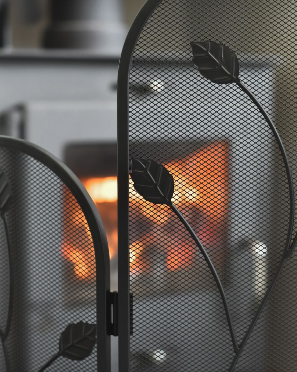 Close up of leaf detailing on fire screen Close up of leaf detailing on fire screen