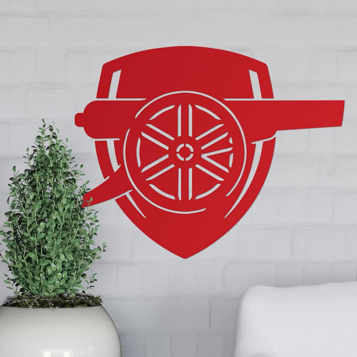 "Arsenal Cannon" Wall Art on a White Brick Wall