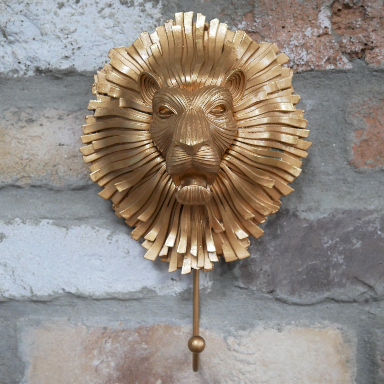 Artistic Gold Lion Hook in Situ on a Brick Wall Artistic Gold Lion Hook in Situ on a Brick Wall