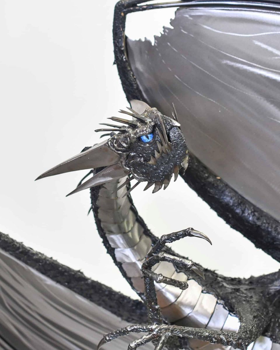 Close-Up of Artist Piece - Large Bespoke Recycled Metal Black "Brachialis" Dragon Sculpture in Situ