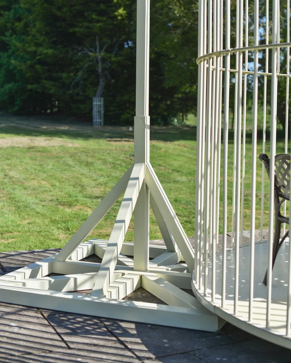 Close up of base detail on ivory coloured steel garden gazebo Close up of base detail on ivory coloured steel garden gazebo
