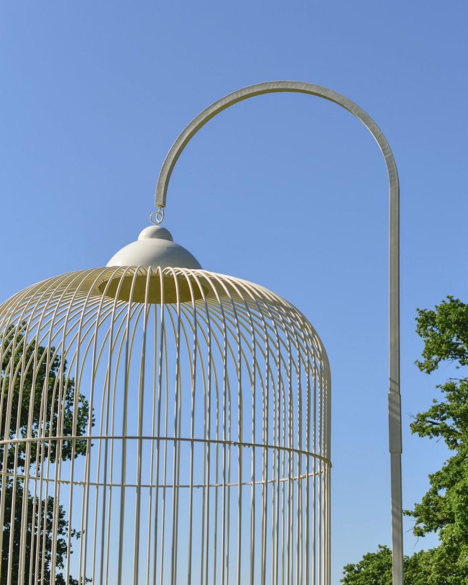 Close up of intricate loop hook detail on ornate ivory birdcage gazebo  Close up of intricate loop hook detail on ornate ivory birdcage gazebo