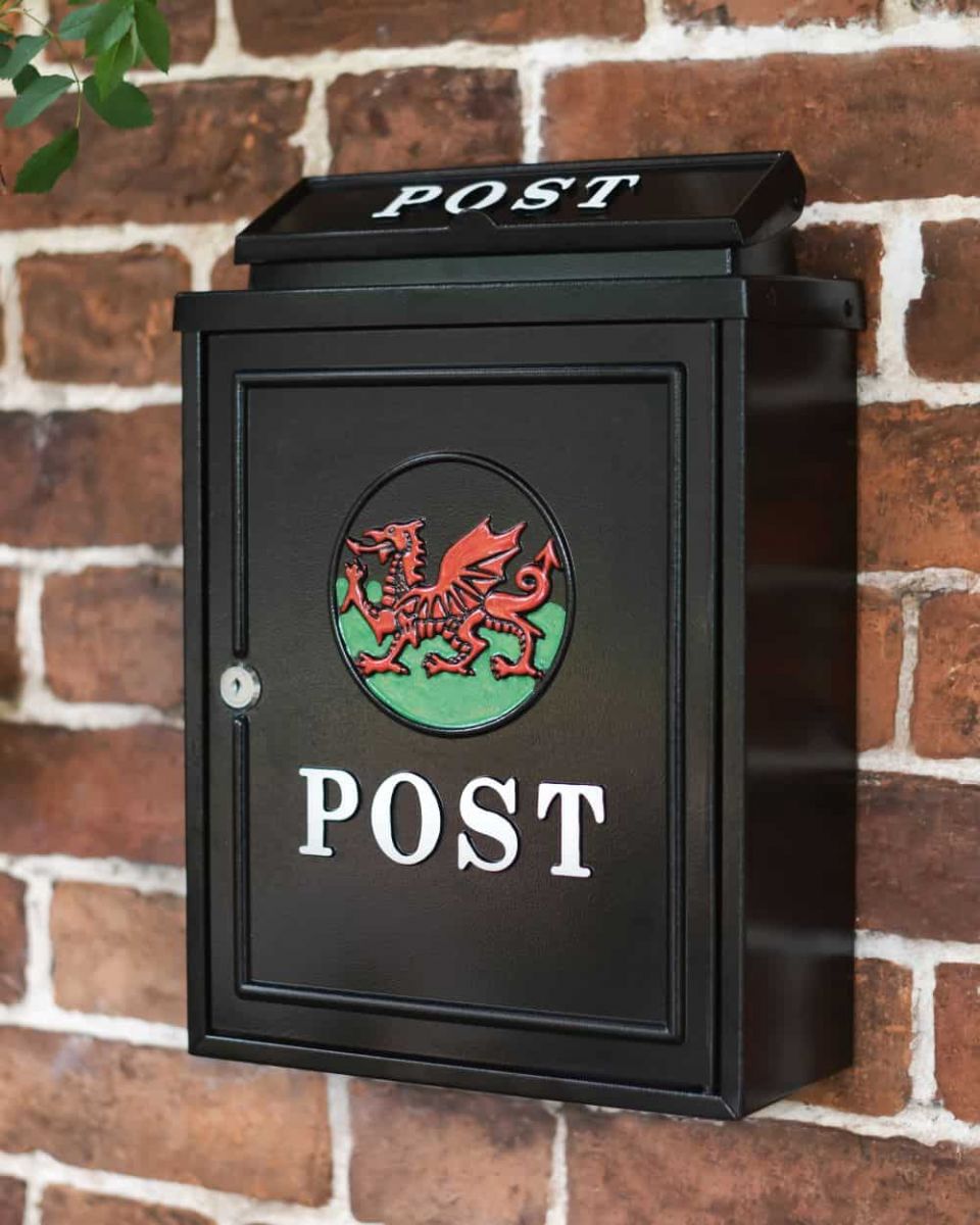 Hand Painted Welsh Dragon Post Box in Situ Mounted on a Brick Wall