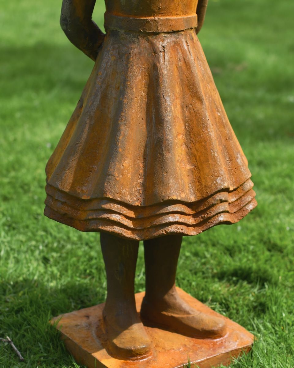 close up of base detail on rustic garden statue