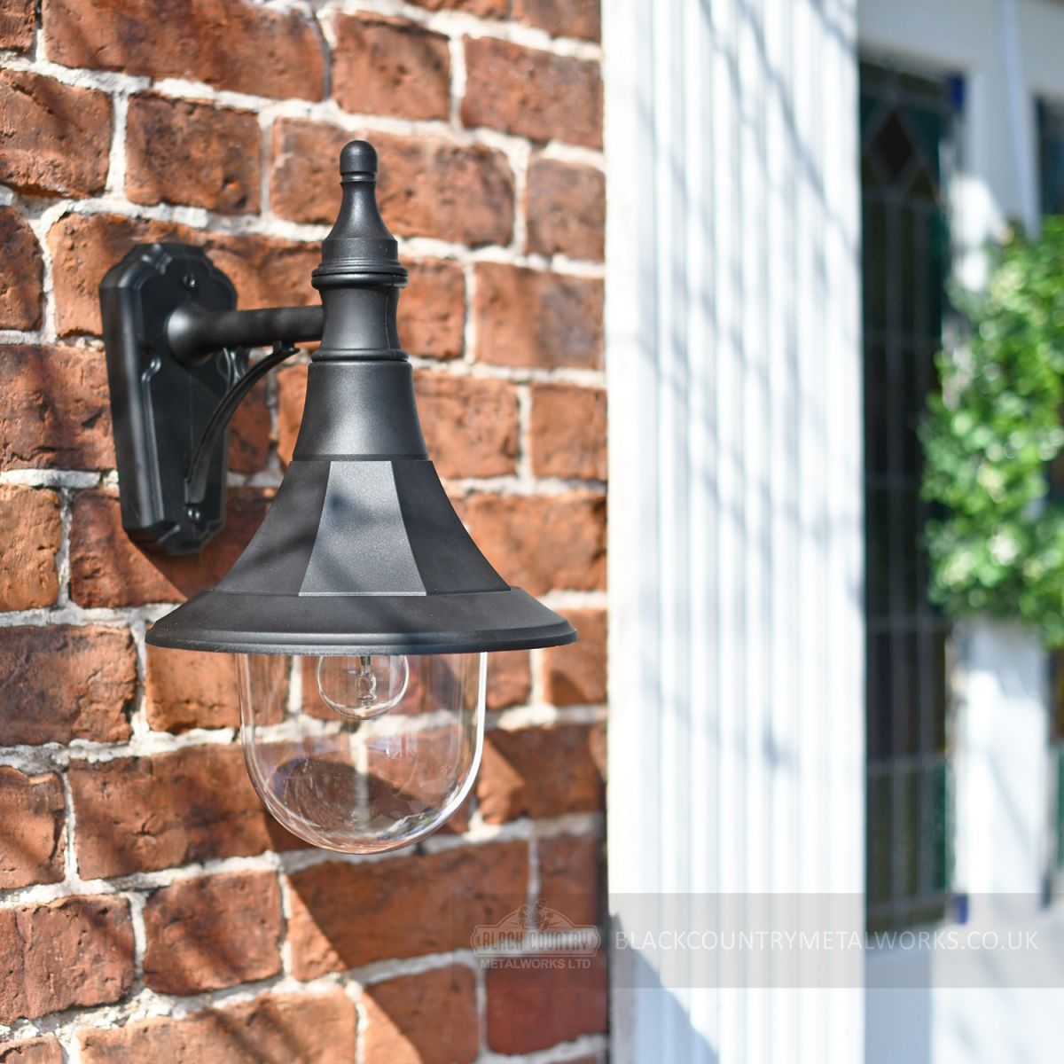 Black doorway lantern on brick wall