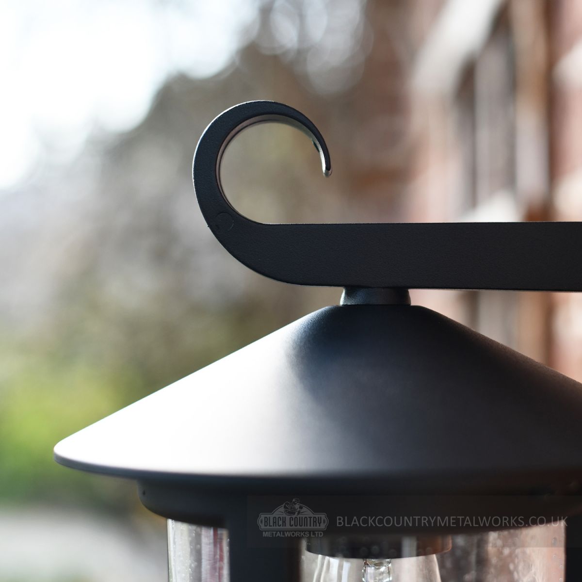 Garden wall light close up of curl