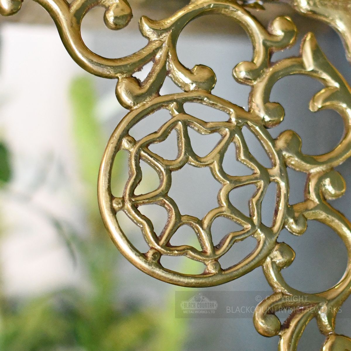 Close up of cast brass scroll detail