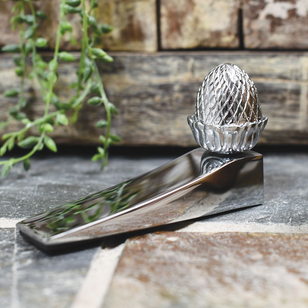Bright chrome acorn door wedge