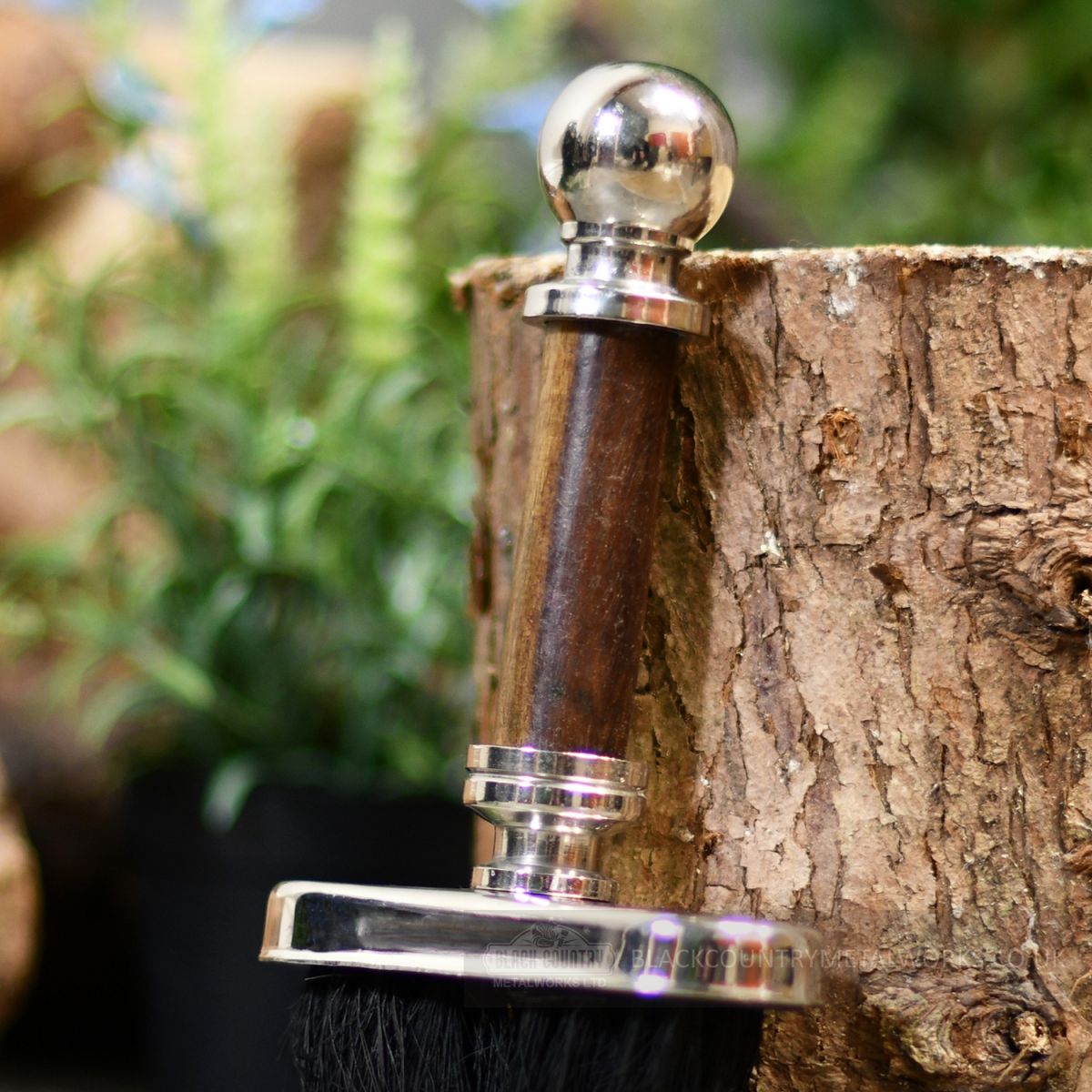 Fireside brush, close up of hardwood handle with ball finial