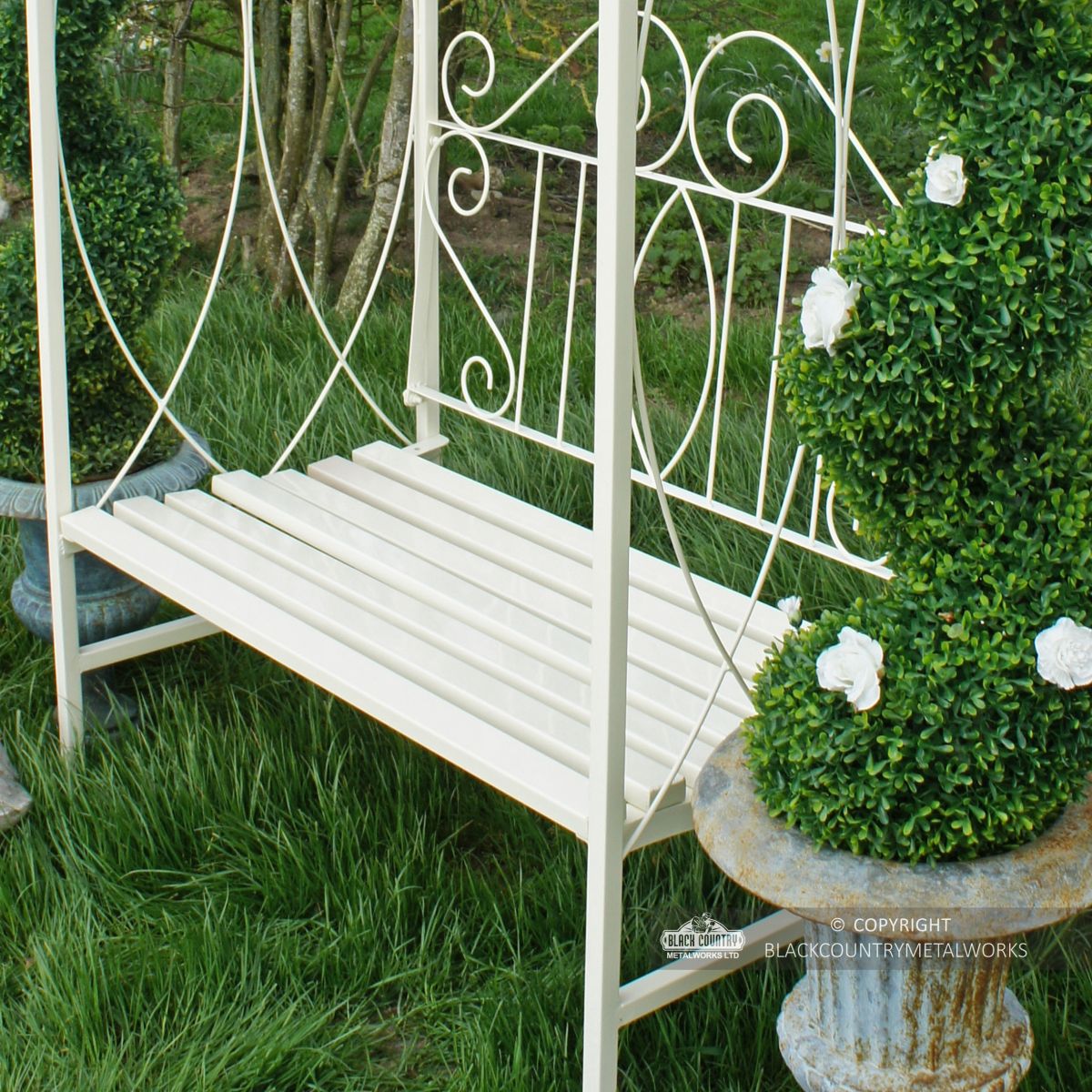 detailed image of hand forged metalwork on arbour seat