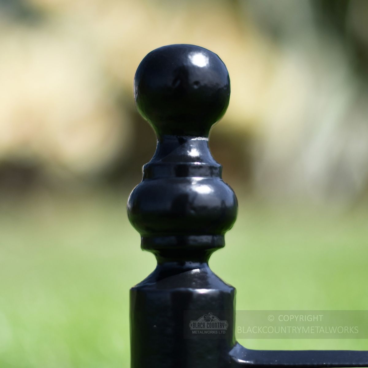 Close up of ball finial on cast iron boot scraper