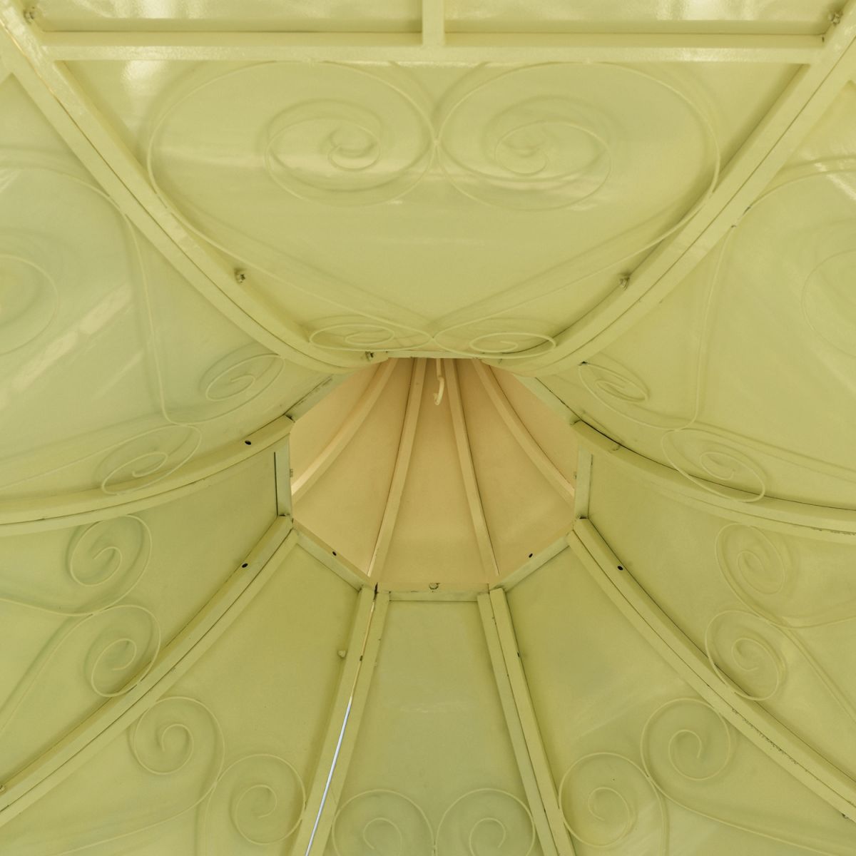 Detailed image of intricate scroll work on underside of roof