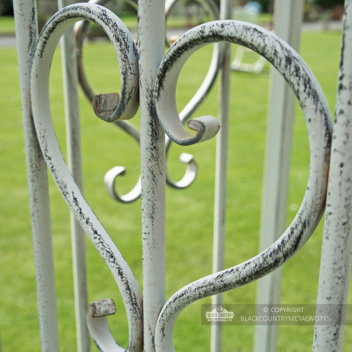 Heart shaped scroll metalwork on gazebo