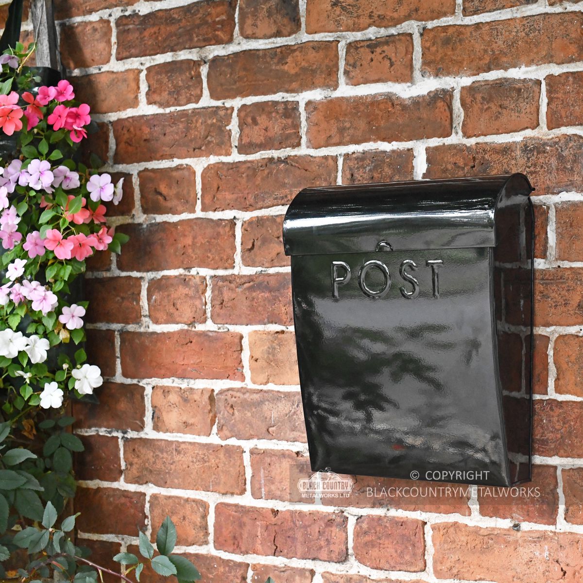 Minimalist black wall mounted letter box