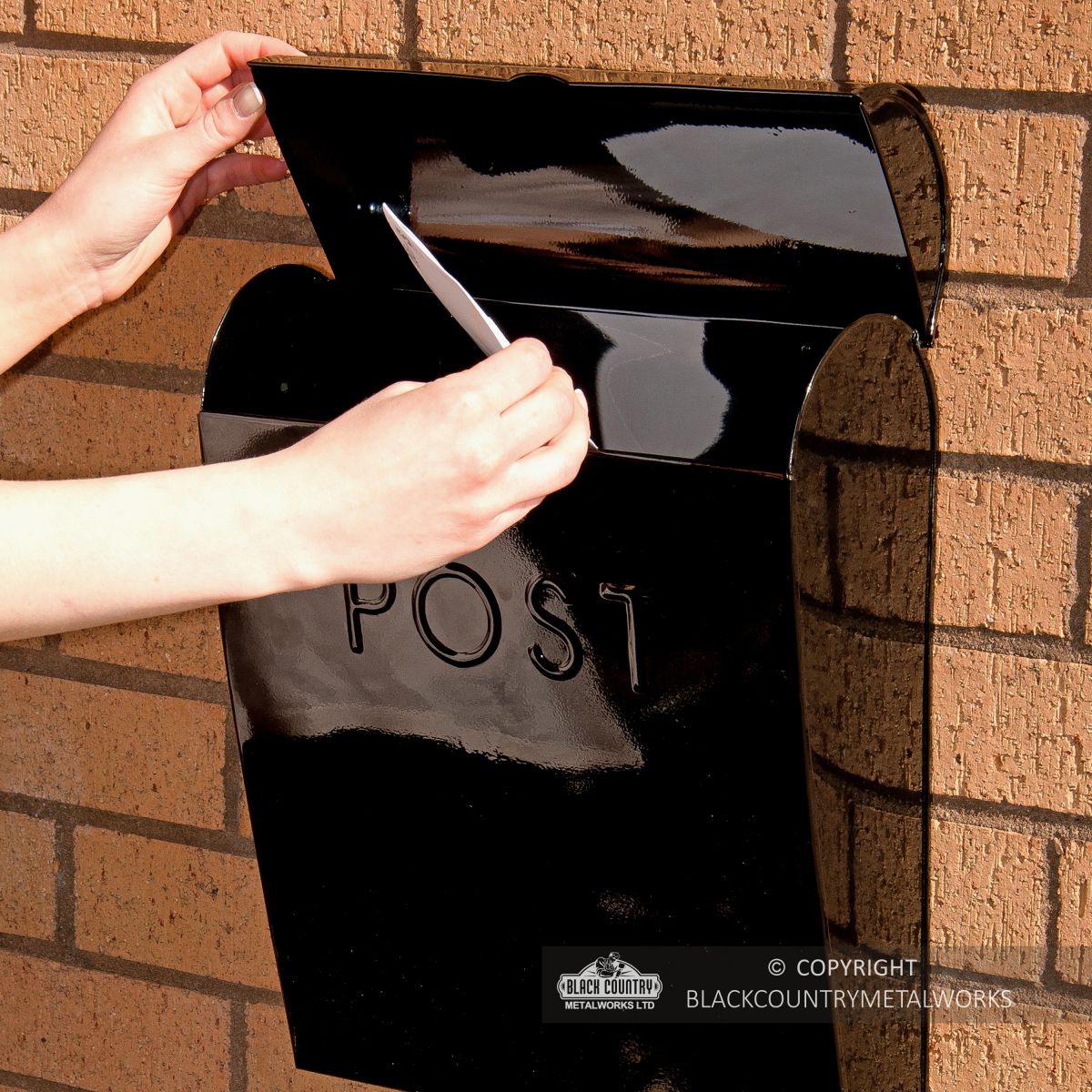 Scale image of black cityscape post box
