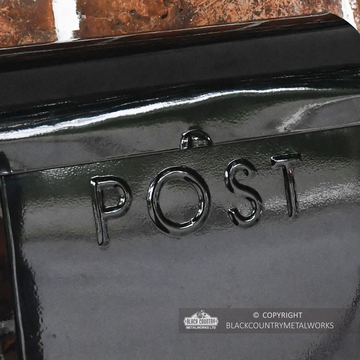 Detailed image of embossed detail on word POST