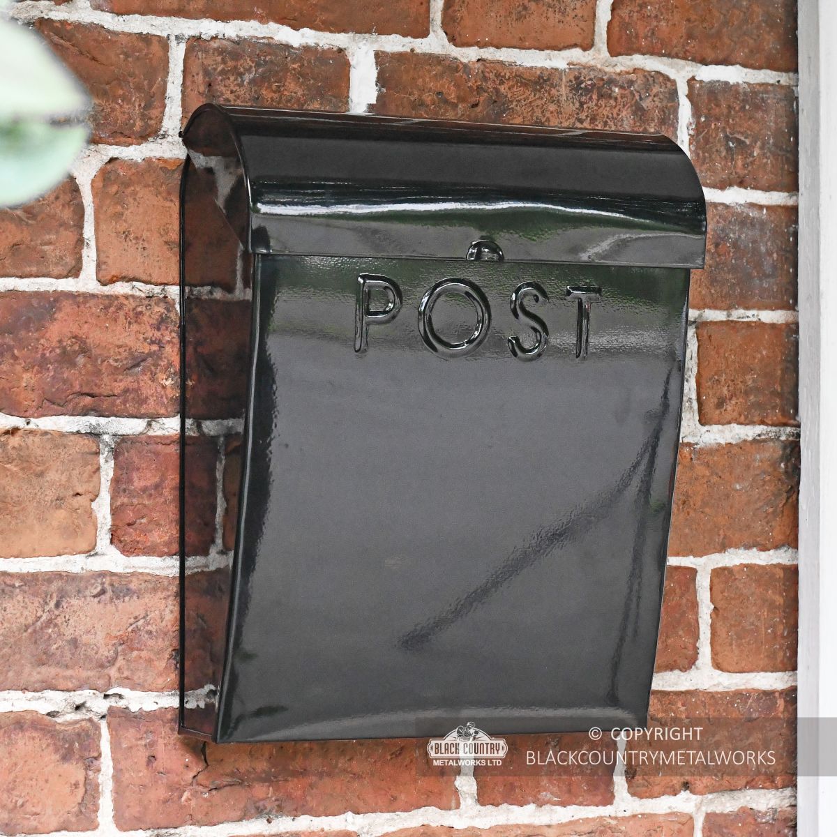 Black contemporary wall mounted post box