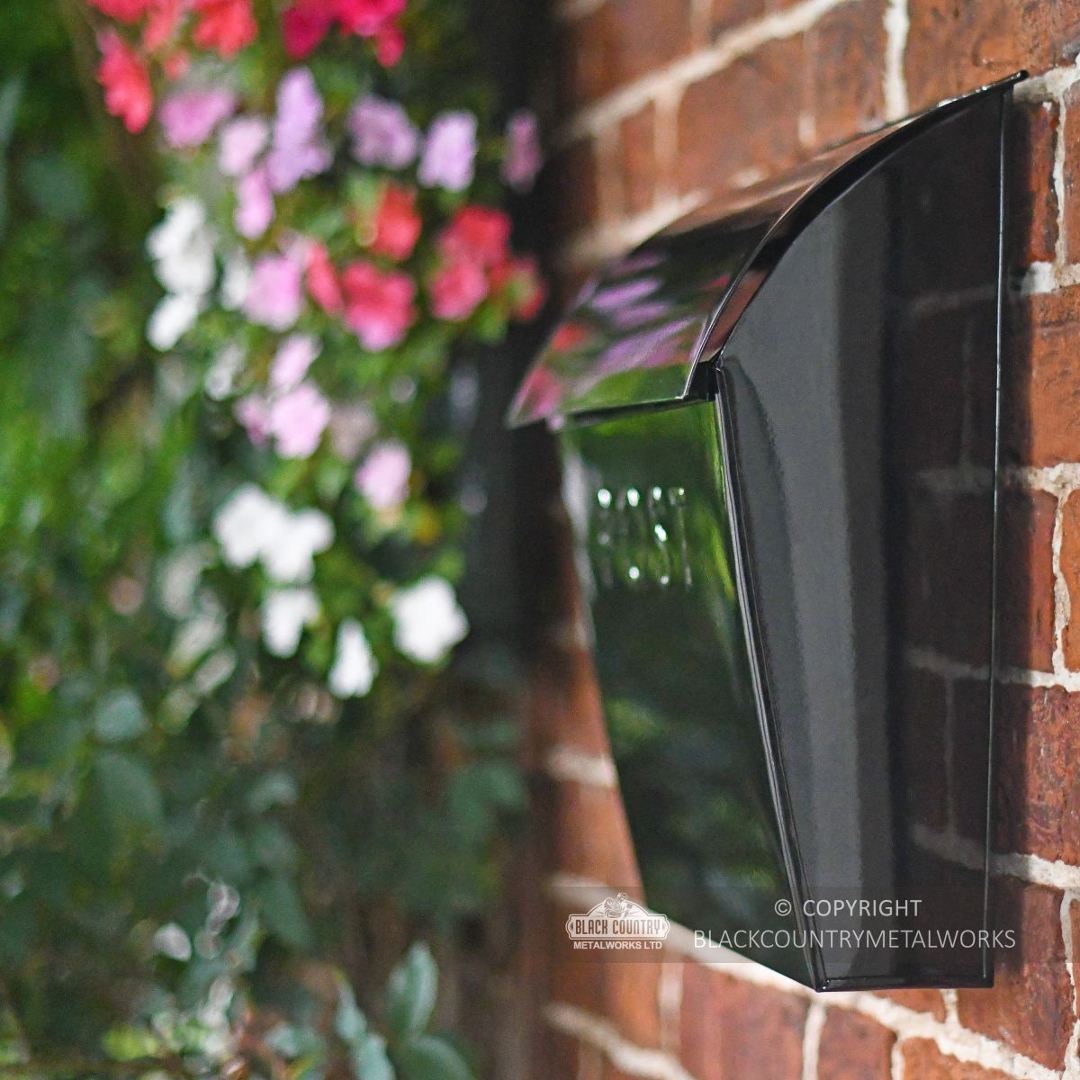 Side view of secure post box with embossed word POST