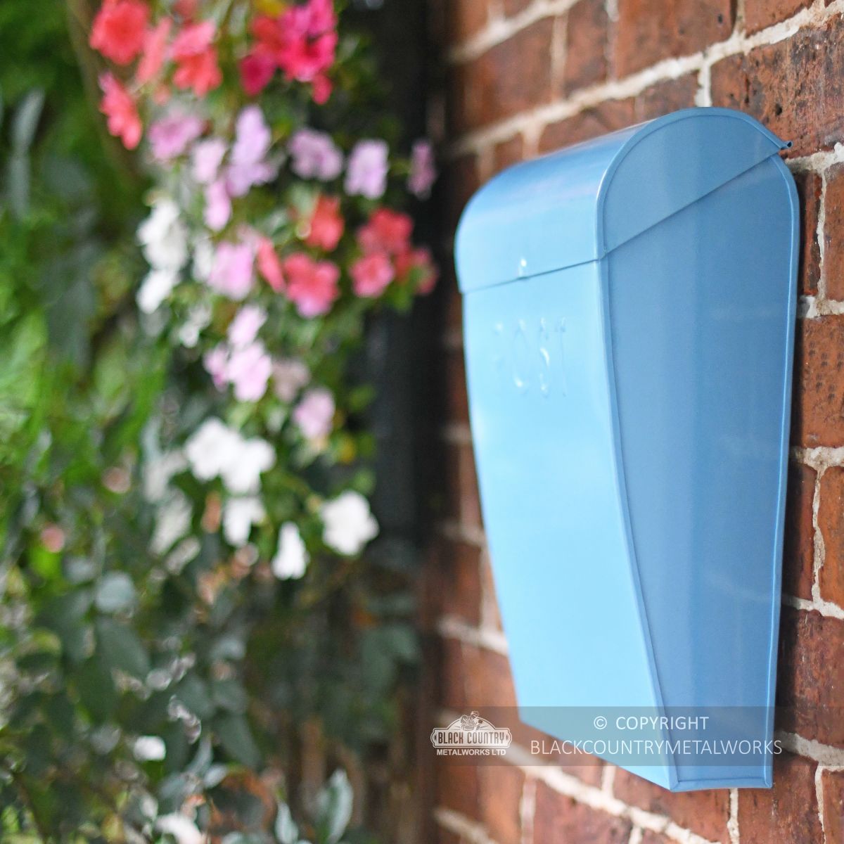 Modern Light blue post box with curved lid