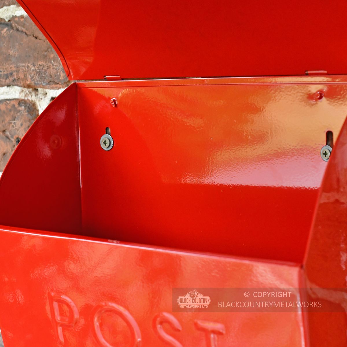 Fixing points for mounting post box to wall