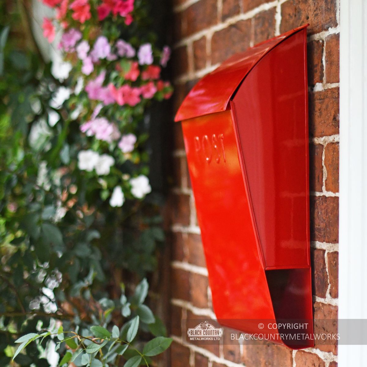 Side view of Berkley hill post box finished in red