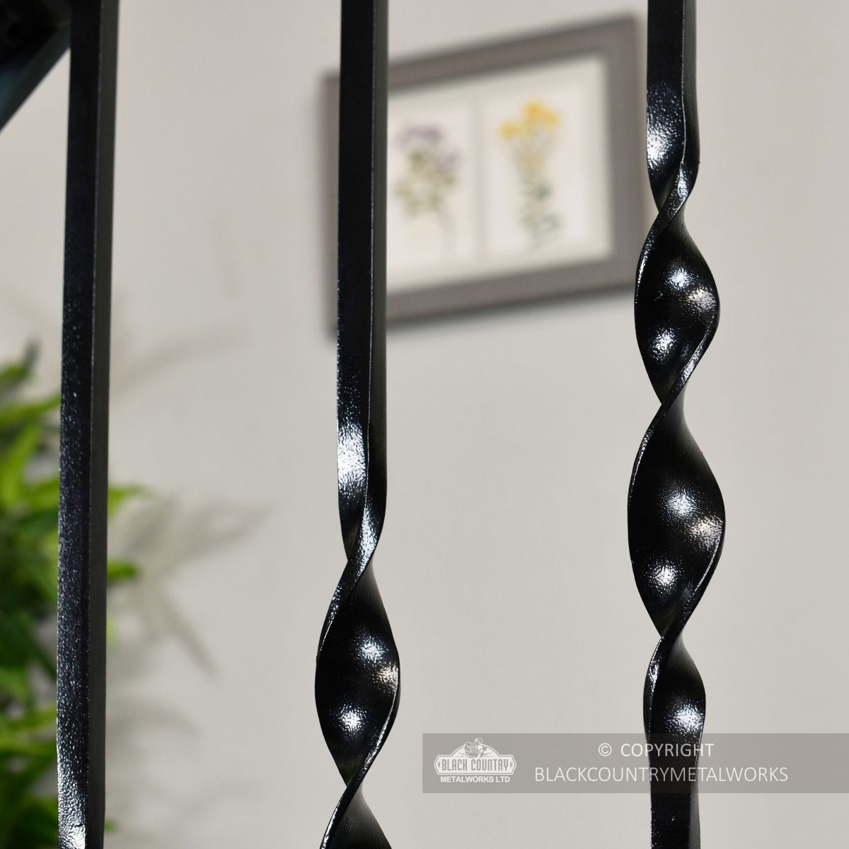 Detailed image of satin black wrought iron spindles