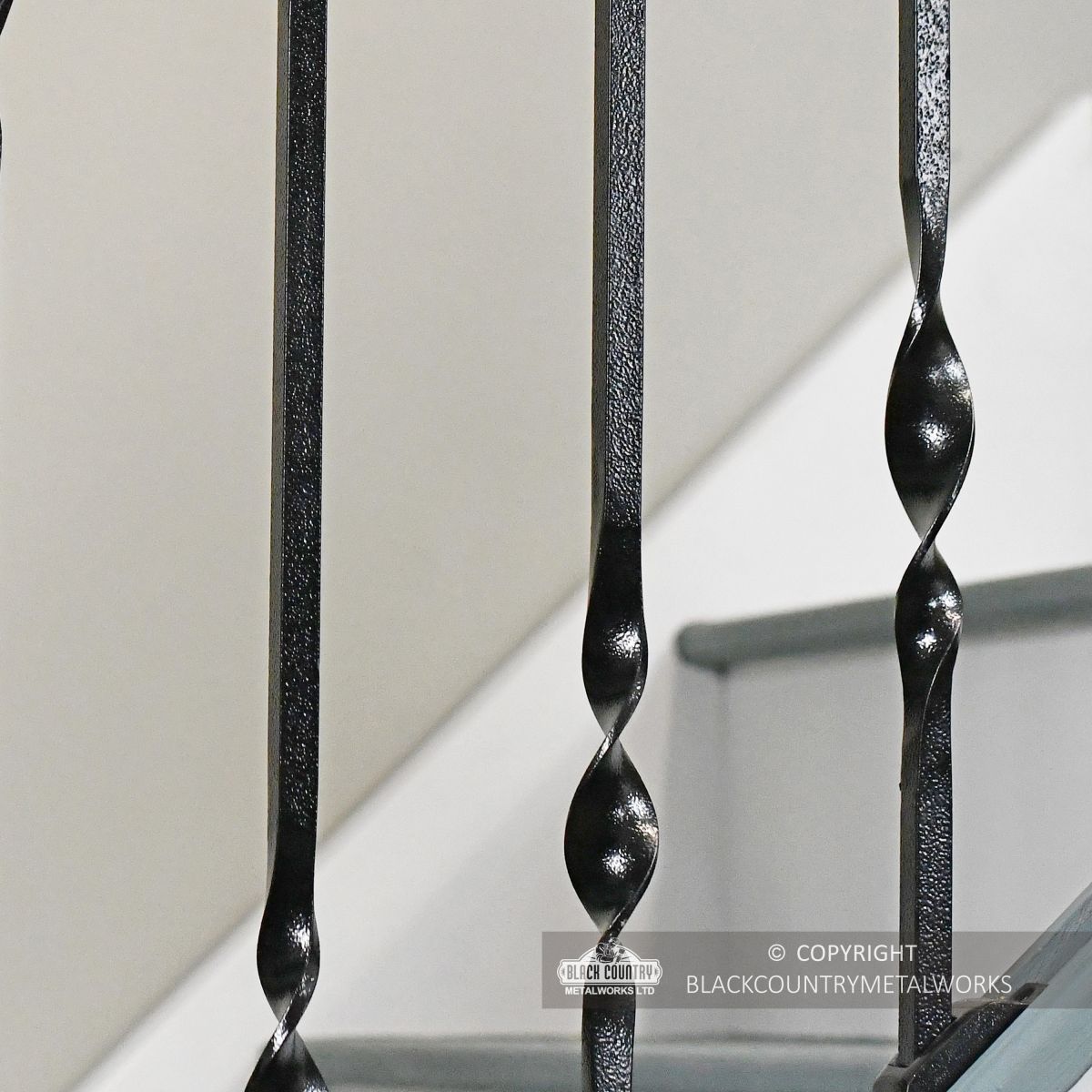 Detailed image of double twist iron spindles