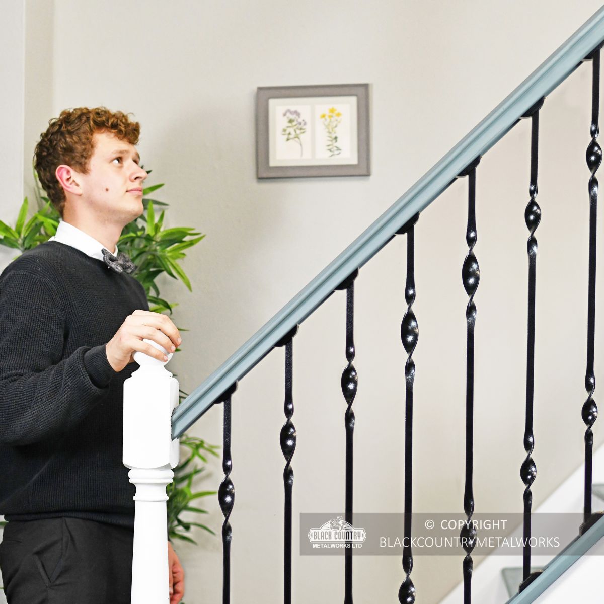 Man standing at foot of stairs