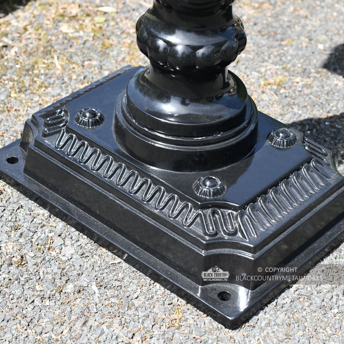 Ornate base with fixing points on garden post box