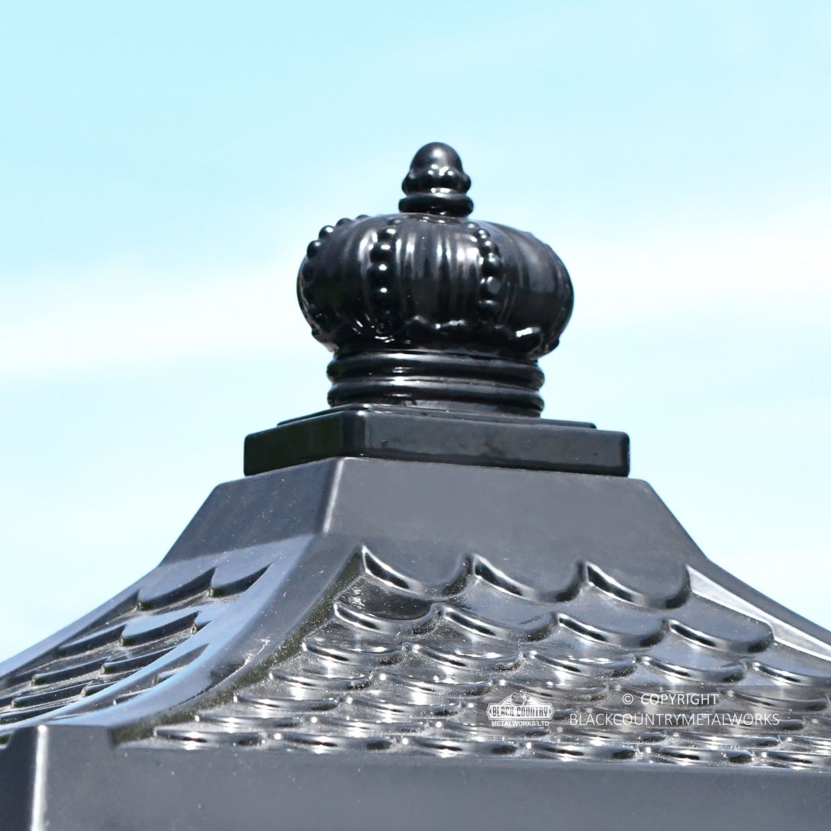 Regal crown finial on black post box