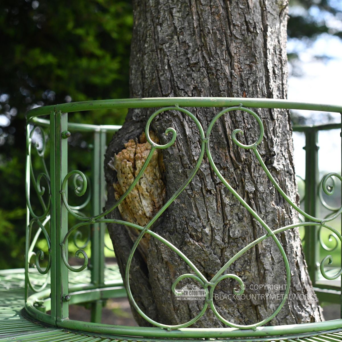 Detailed image of ornate scroll design backrest on tree seat