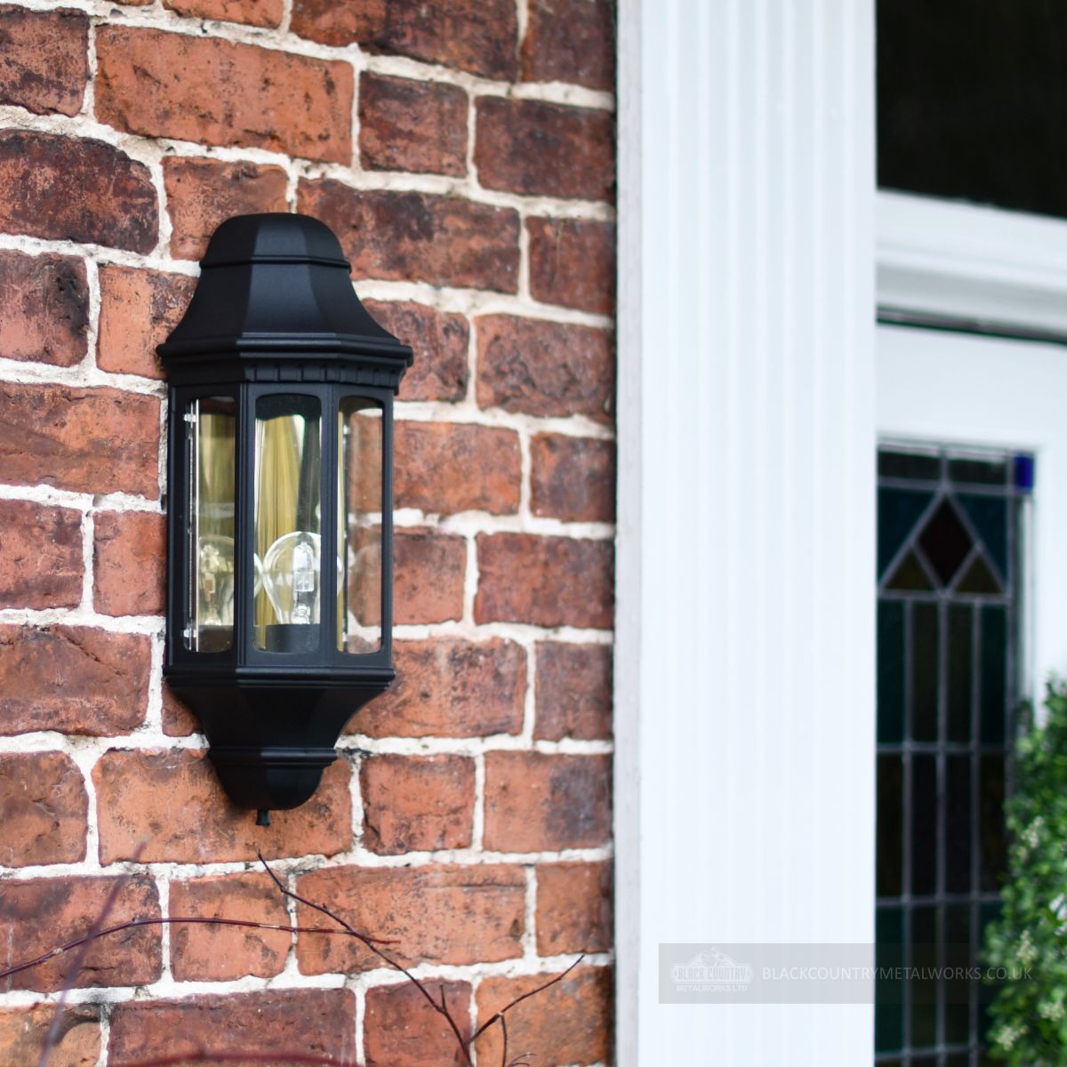beautiful wall lantern with mirrored back on brick wall beautiful wall lantern with mirrored back on brick wall