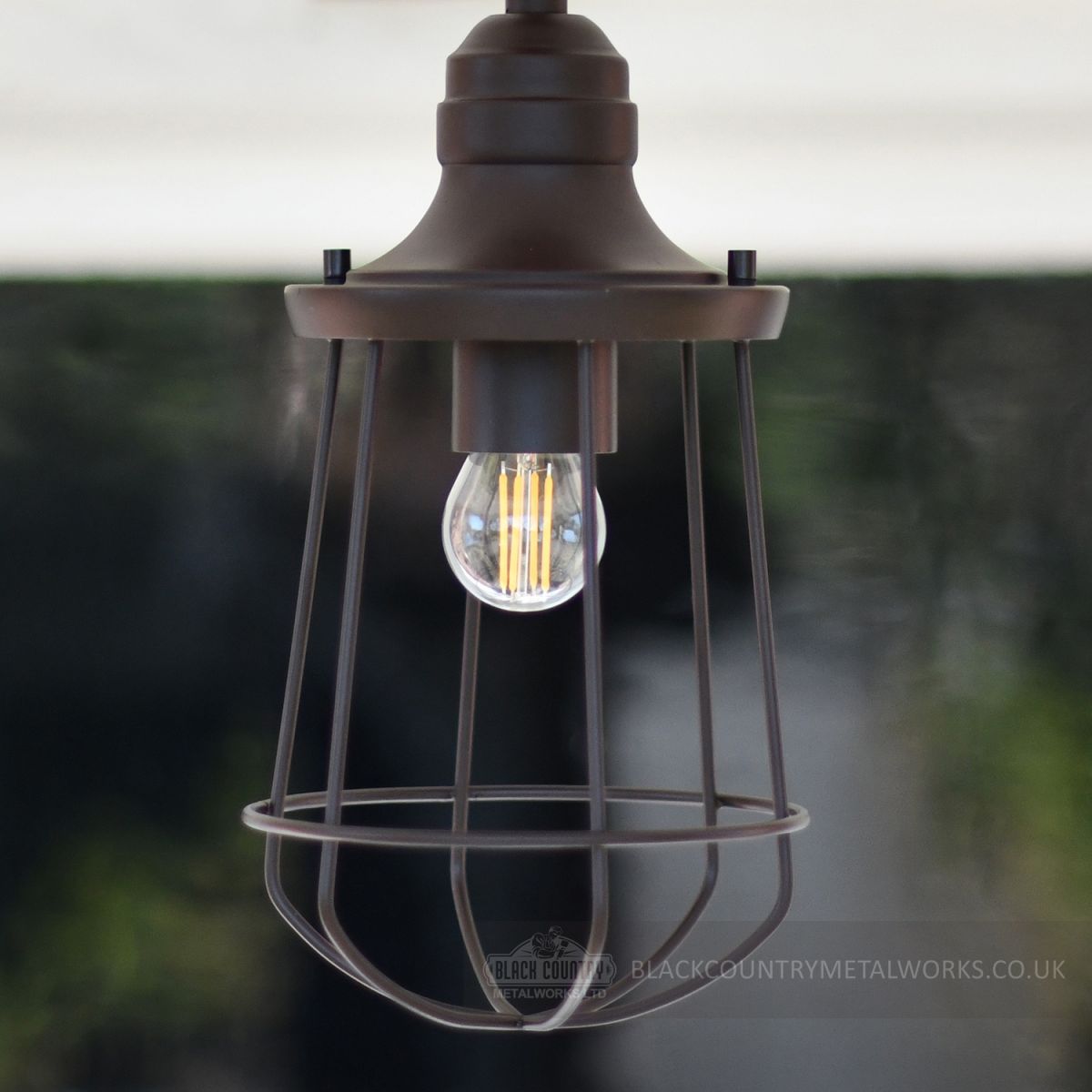 Hanging lamp finished in dark bronze