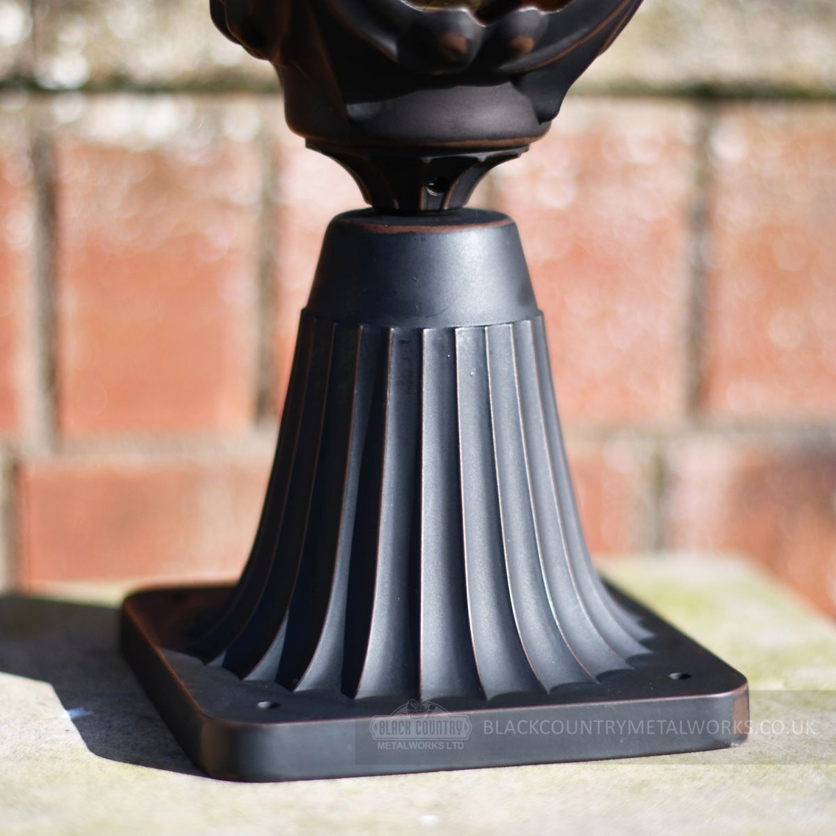 Close up of aged antique bronze driveway lantern