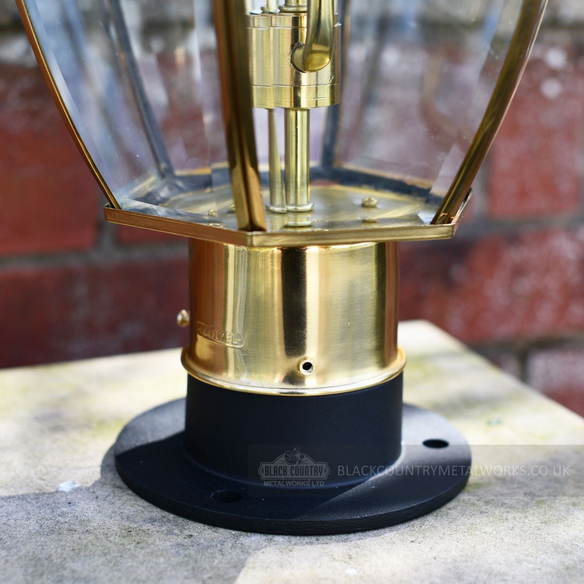 close up of rounded base on pillar lantern