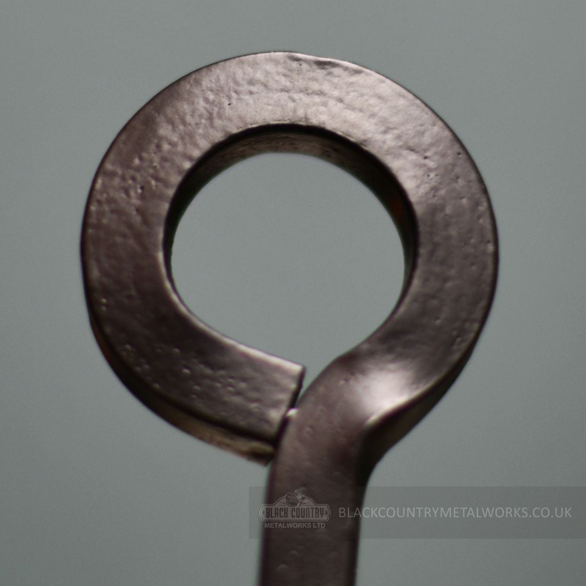 Traditional hand forged handle on brush fireside tool