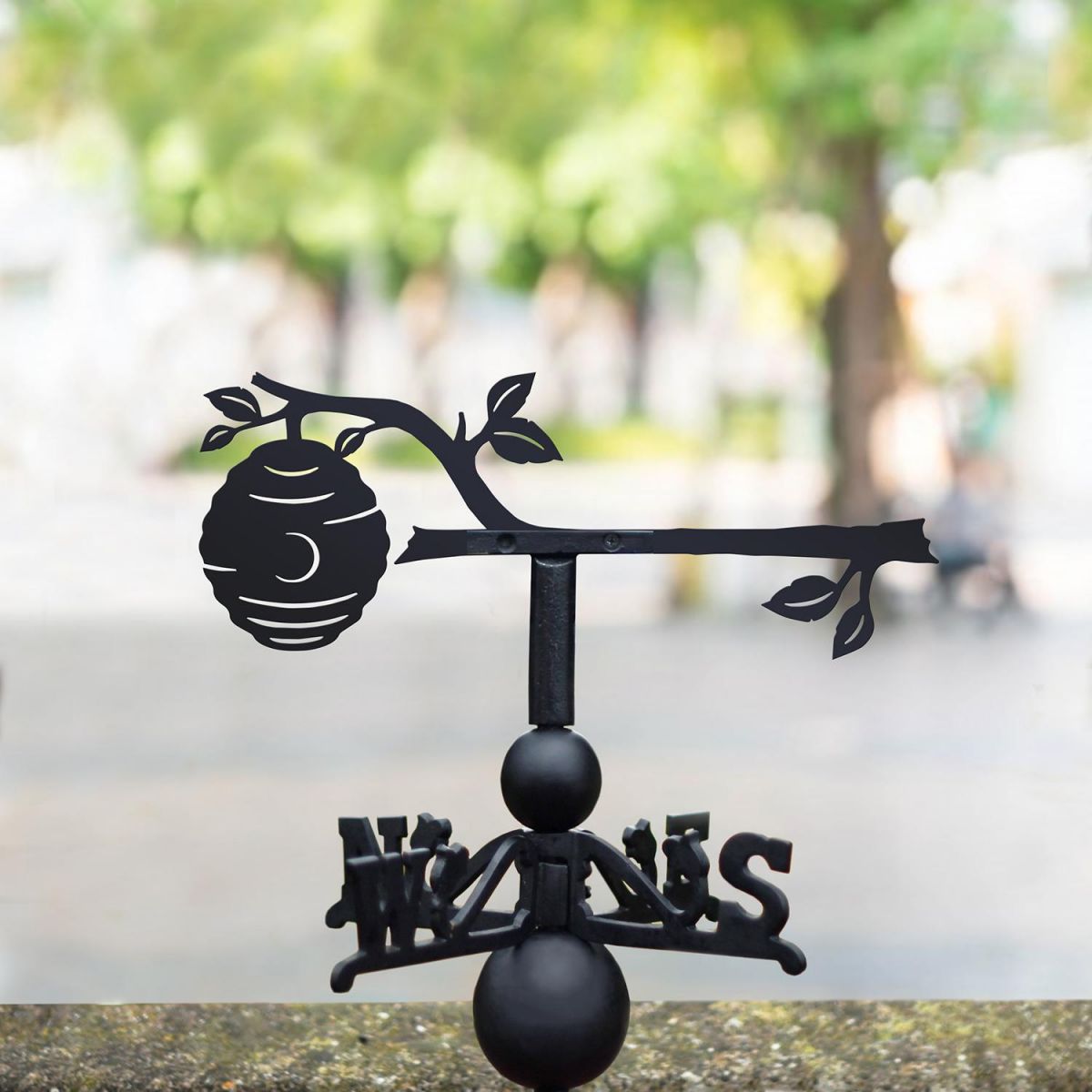 Beehive on Branch Weathervane Being Used on the Top of a Roof